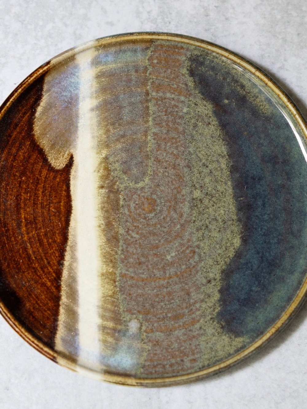 Handmade signed pottery plate 7 inches blue brown